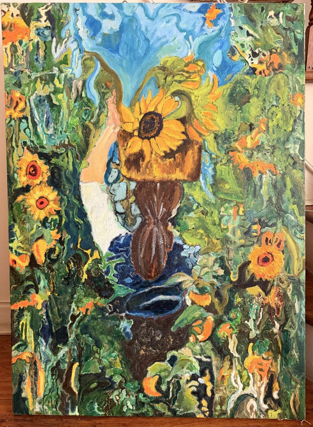 Oil painting of a woman lifting a basket of sunflowers above her head in a dense green sunflower field